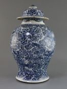 A large Chinese blue and white vase and cover, Kangxi period, painted with phoenix amongst flowering