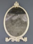 An 18th century French Dieppe ivory toilet mirror, c.1765, with cartouche crest, scroll feet and