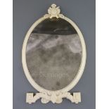 An 18th century French Dieppe ivory toilet mirror, c.1765, with cartouche crest, scroll feet and