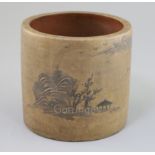 A Chinese Yixing brush pot, slip decorated with a pavilion and rocks and an inscription, impressed