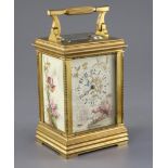 An early 20th century ormolu and porcelain hour repeating carriage clock, the dial and side panels