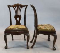 A set of eight George II style Irish 'red walnut' and oak dining chairs,