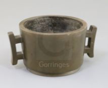 A Chinese bronze censer, of tapering cylindrical form, applied with a pair of trellis shaped