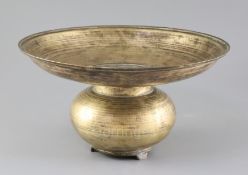 A 17th century Indian bronze spittoon, with bulbous base and three feet, diameter 13in. height 7.