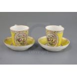 A pair of Derby Pinxton/Mansfield porcelain chocolate cups and saucers, c.1790-1800, painted with