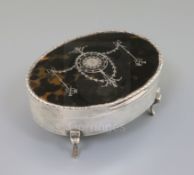 A George V silver and tortoiseshell pique oval trinket box, William Comyns, London, 1912, 15.2cm.