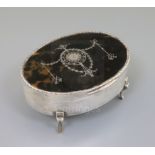 A George V silver and tortoiseshell pique oval trinket box, William Comyns, London, 1912, 15.2cm.