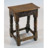 A James I oak joint stool, with carved frieze and turned legs, 1ft 3.5in x 9in. H.1ft 8.5in.