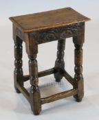 A James I oak joint stool, with carved frieze and turned legs, 1ft 3.5in x 9in. H.1ft 8.5in.