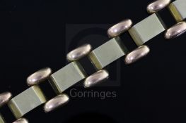 A stylish mid 20th century Hungarian two colour 14ct gold domed and brick link bracelet, 18.5cm.