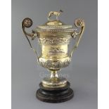 A handsome George III silver gilt two handled presentation pedestal trophy cup and cover by