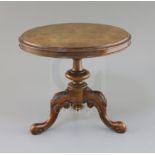 A Victorian walnut miniature tripod table, with circular tilt top and carved tripod, 10.25in. height