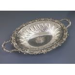 A good George III Sheffield plate two-handled embossed oval fruit bowl, with rose and gadrooned