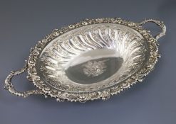 A good George III Sheffield plate two-handled embossed oval fruit bowl, with rose and gadrooned