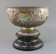 A late Victorian repousse silver presentation pedestal punch bowl, by William Hutton & Sons, with