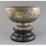 A late Victorian repousse silver presentation pedestal punch bowl, by William Hutton & Sons, with