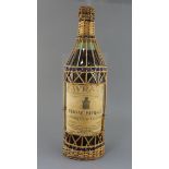 A 5 litre bottle of Cognac Favraud Chateau de Souillac, label listing prize medals up to 1908,