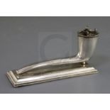 An Edwardian novelty silver table lighter, modelled as a smoker's pipe on a rectangular base, John