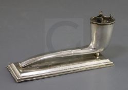 An Edwardian novelty silver table lighter, modelled as a smoker's pipe on a rectangular base, John