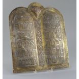 Judaica: A 19th century Cairoware arched plaque inscribed with the Ten Commandments, width 11.25in.,