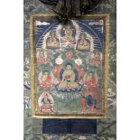 A thangka depicting Buddha Shakyamuni, Tibet, 19th century, the central figure surrounded by three