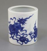 A Chinese blue and white 'Buddhist lion' brushpot, the figures playing with brocaded balls, six