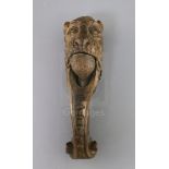 An early 19th century treen nutcracker, carved with the head of a lion, 10in.