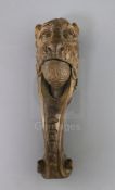 An early 19th century treen nutcracker, carved with the head of a lion, 10in.