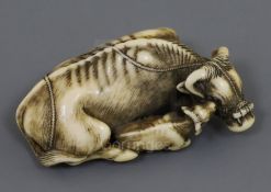 A fine Japanese ivory netsuke of an ox and calf, signed Tomotada, Kyoto School, c.1760-80, with horn