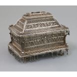 A 19th century Indian silver filigree casket, of rectangular form, on pierced scroll feet, plaque on