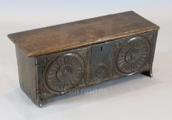 A small late 16th century carved oak six plank coffer, with triple roundel carved front, W. 2ft 6.