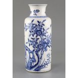 A Chinese blue and white cylindrical vase, Kangxi period, painted with flowering branches, insects