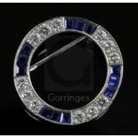 A modern Boodle & Dunthorne 18ct white gold, sapphire and diamond openwork circular brooch, 24mm.