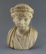 After the antique. An early 19th century marble bust of an Imperial Roman youth wearing a laurel