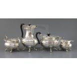 A George V four piece silver tea service set by Gibson & Co, of oval form, with pierced wavy