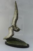 Irene Rochard. An Art Deco bronze model of a seagull flying over a wave, signed in the bronze, on