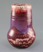 A Ruskin high-fired flambe vase, early 20th century, decorated with a Sang de Boeuf purple