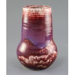 A Ruskin high-fired flambe vase, early 20th century, decorated with a Sang de Boeuf purple