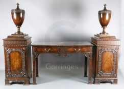 A late Victorian Chippendale style mahogany serving table with pedestal cupboards, each mounted an