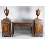 A late Victorian Chippendale style mahogany serving table with pedestal cupboards, each mounted an