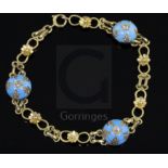 A 9ct gold, turquoise and diamond set fancy link bracelet, set with three inset diamond turquoise