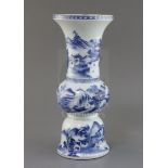 A Chinese blue and white beaker 'landscape' vase, gu, Kangxi period, painted with figures in