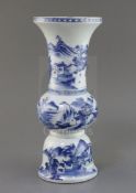 A Chinese blue and white beaker 'landscape' vase, gu, Kangxi period, painted with figures in