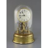 A Eureka & Co. Ltd, London. A gilt brass and steel electric timepiece enamelled Arabic dial, No.