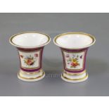 A pair of Rockingham porcelain miniature vases, c.1830, each painted with flower bouquets on a