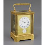 A late 19th century French ormolu hour repeating giant carriage clock, with alarm, with foliate
