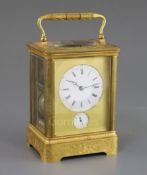 A late 19th century French ormolu hour repeating giant carriage clock, with alarm, with foliate