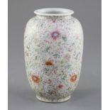A Chinese famille rose ovoid vase, Qing dynasty, finely painted with flowers and scrolling