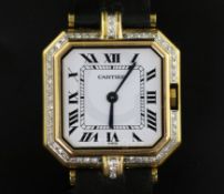 A lady's 18ct gold and diamond set Cartier quartz octagonal cased wrist watch, with Roman dial and