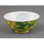 A Chinese yellow and green enamelled 'dragon' bowl, Qianlong seal mark and of the period (1736-95)